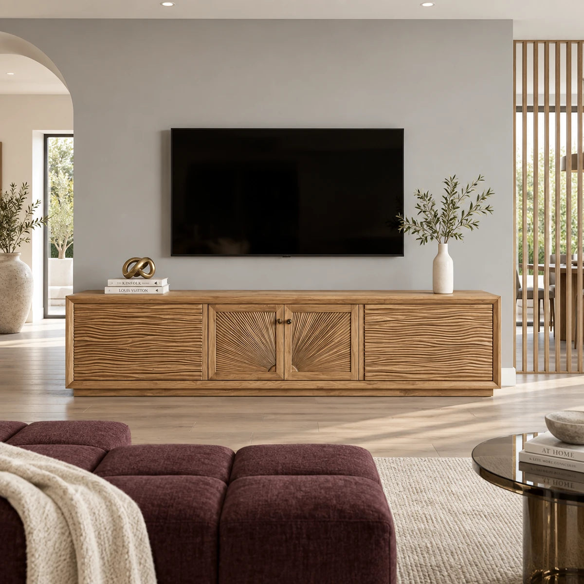 Architectural media stand in solid wood with textured fronts and linear storage design
