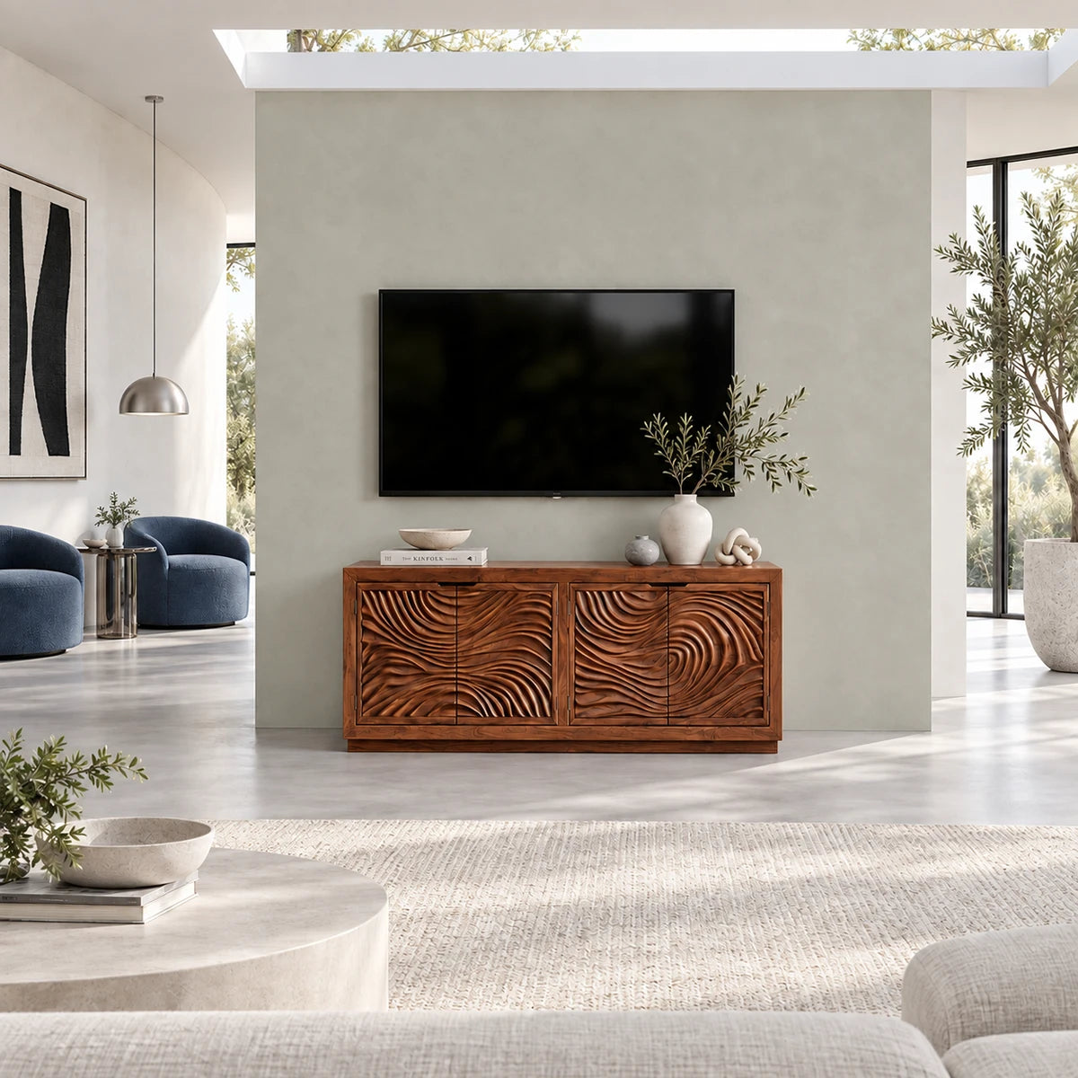 Wide entertainment console in solid wood with sculpted front panels and modern geometry
