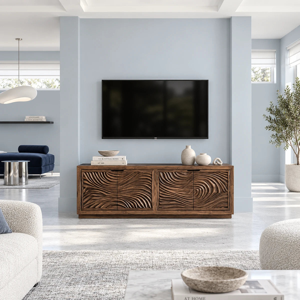 Designer entertainment unit in solid wood with carved ripple panels and sleek proportions
