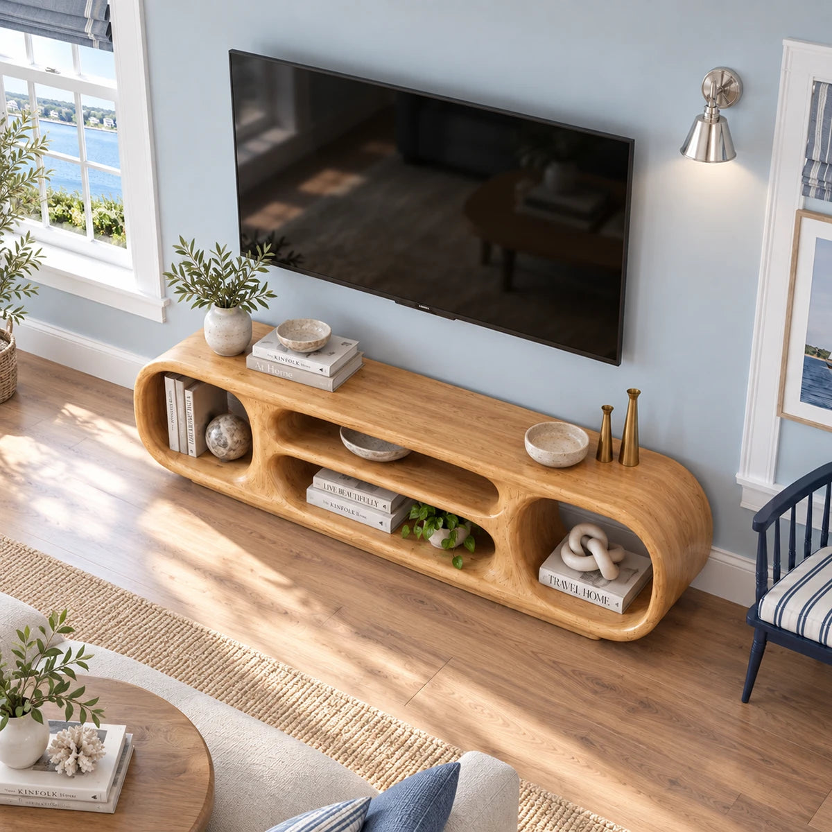 Sculptural low profile TV stand in natural solid wood with rounded open cubbies form