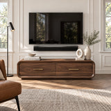 Statement TV stand in solid wood with an elongated form, two drawers, and brass pulls