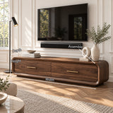 Elegant media stand in solid wood with curved edges, brass hardware, and hidden storage
