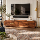Refined entertainment unit in solid wood with seamless curves and wide drawer fronts
