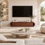 Elegant media stand with curved edges and closed storage anchors a modern living room