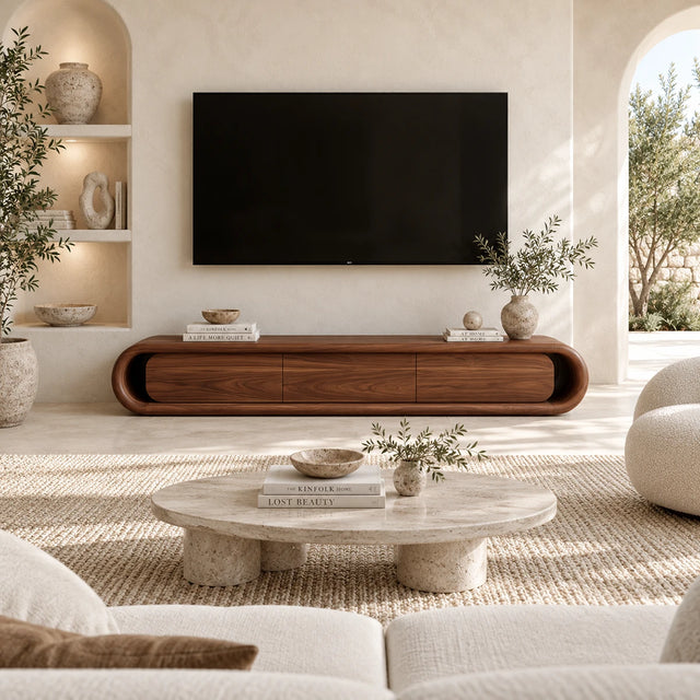 Low profile media console with soft curved edges and clean doors for a refined interior