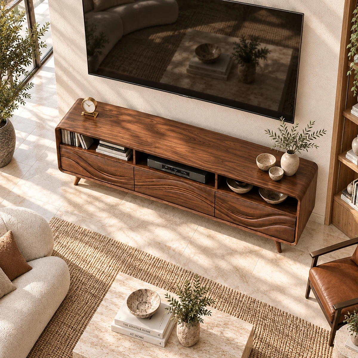 Wide entertainment unit with carved wave panels and accessible storage for media gear