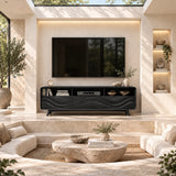 Decorative TV cabinet with sculpted wave fronts and open compartments for electronics