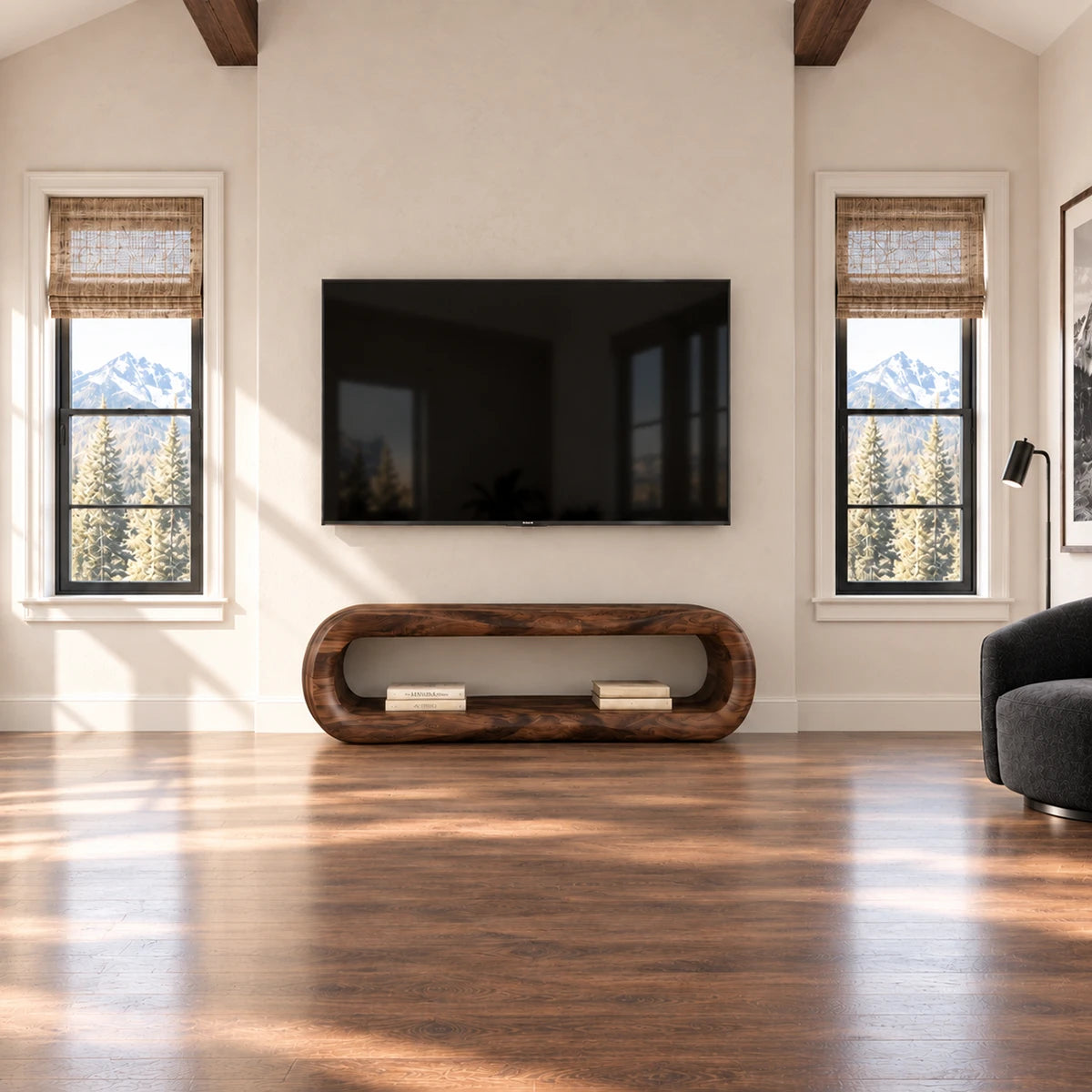 Designer television stand with clean open shelving and softly curved architectural form