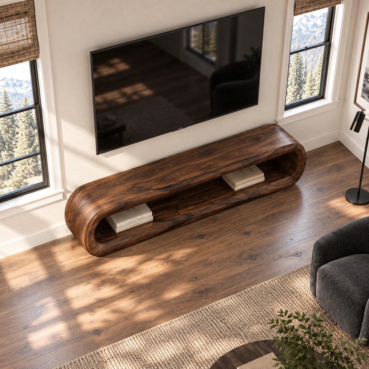 Refined TV console with sculpted rounded ends and long open shelf for books and media