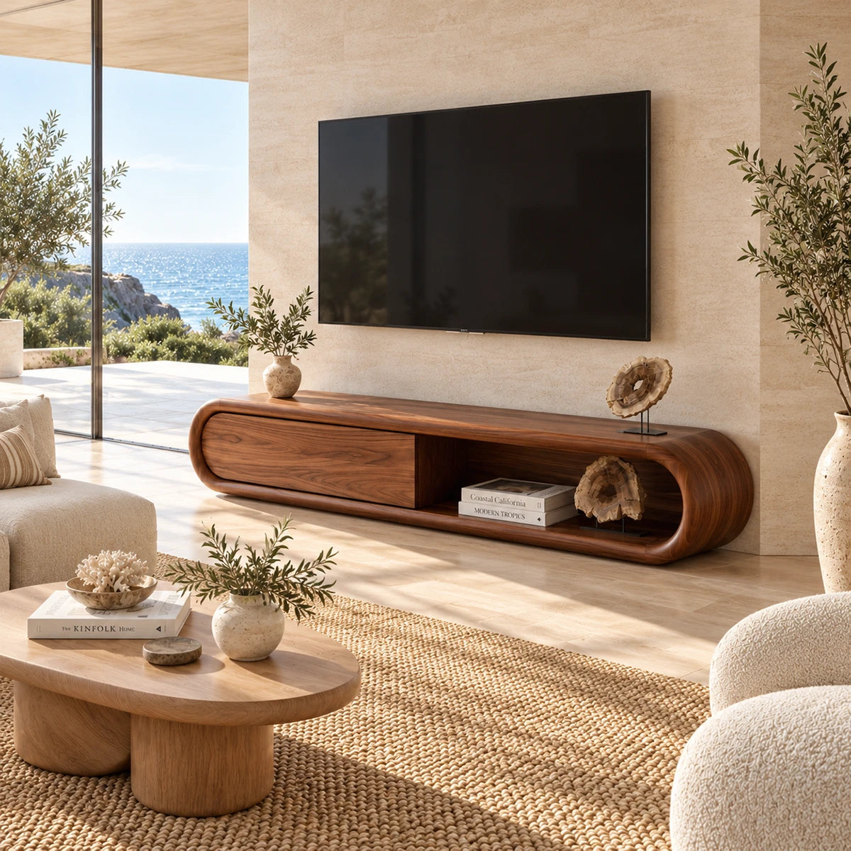 Low profile TV cabinet with open shelving and smooth doors beneath a wall mounted screen