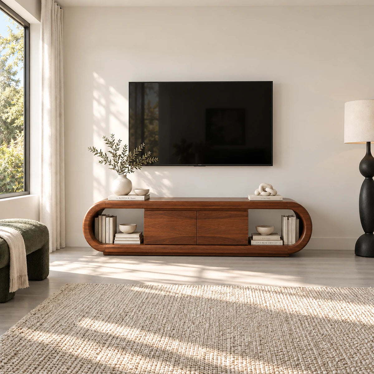 Modern entertainment stand in solid wood with soft curves and side book storage space