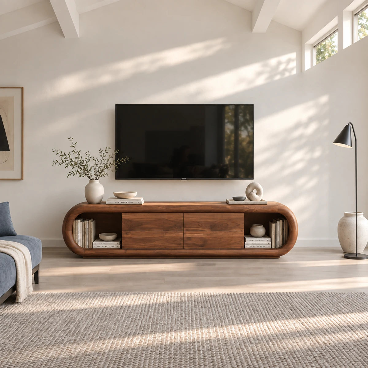 Architectural television console in solid wood with rounded silhouette and drawers

