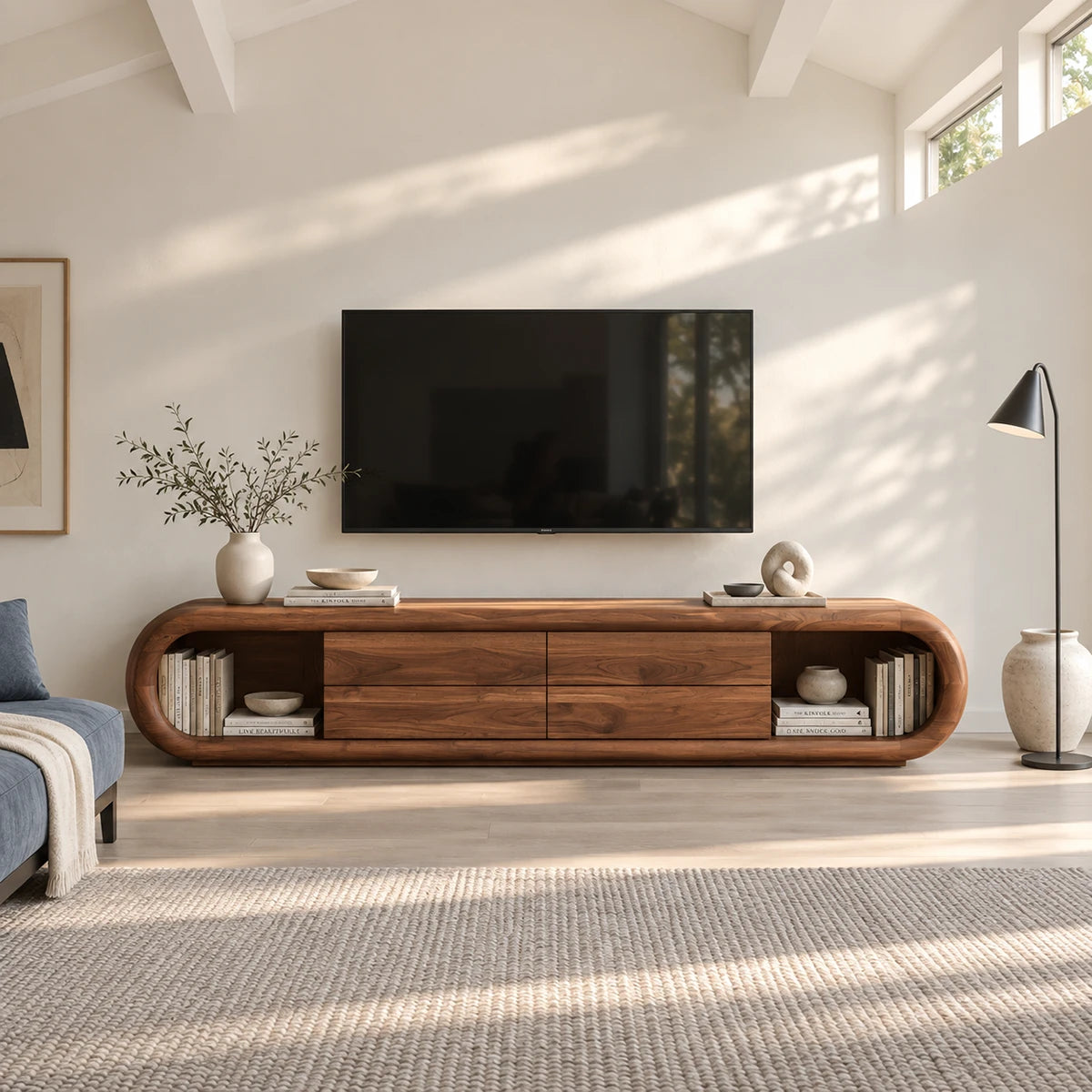 Rounded TV stand in solid wood with four drawers and open side shelving for storage
