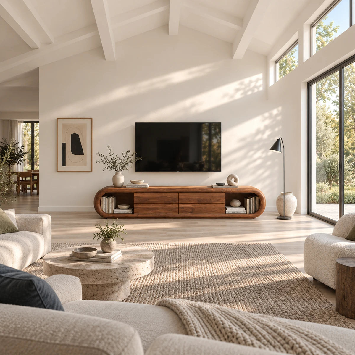 Curved media console in solid wood with four center drawers and display niches
