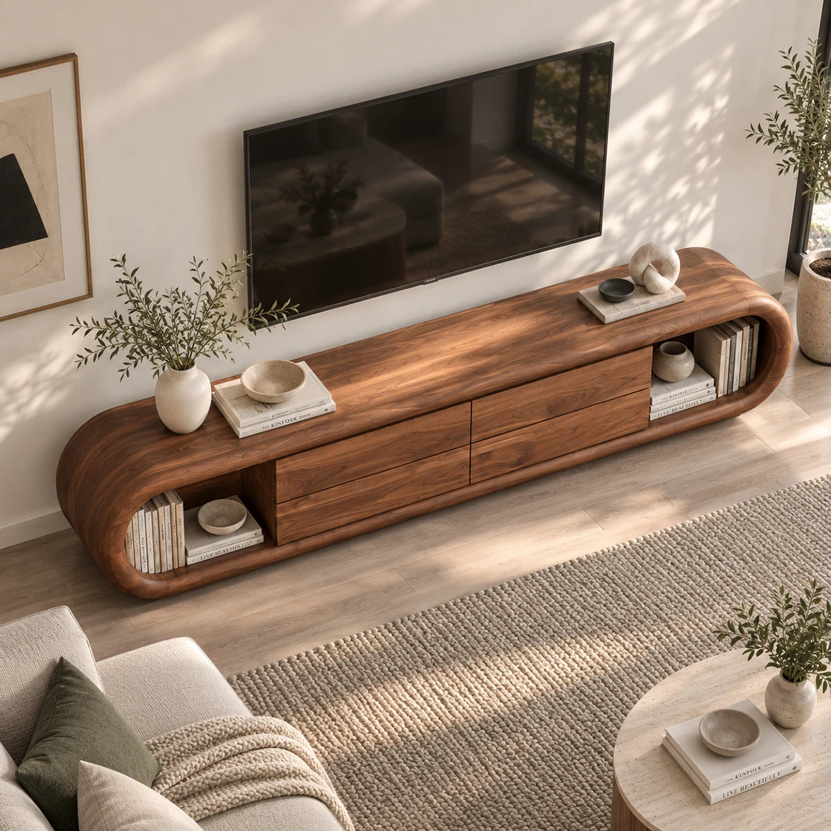 Minimalist media cabinet in solid wood with rounded corners and open book storage

