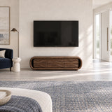 Architectural entertainment console in solid wood with flowing fronts and low base
