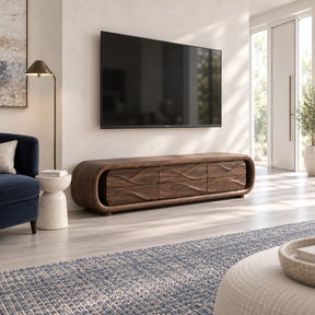 Rounded solid wood TV stand with wave-front drawers in a bright modern living room

