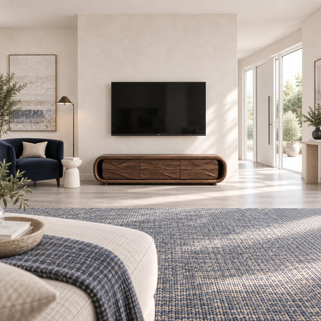 Low profile media console in solid wood with sculpted drawer fronts and soft curves
