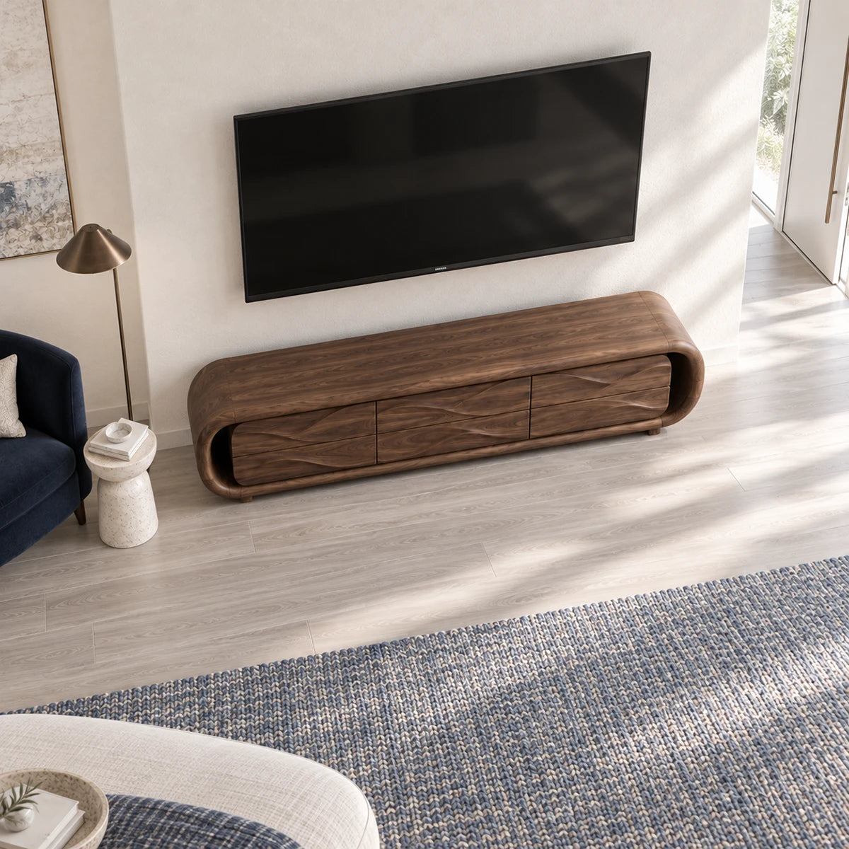 Contemporary TV console in solid wood with carved wave drawers and rounded edges
