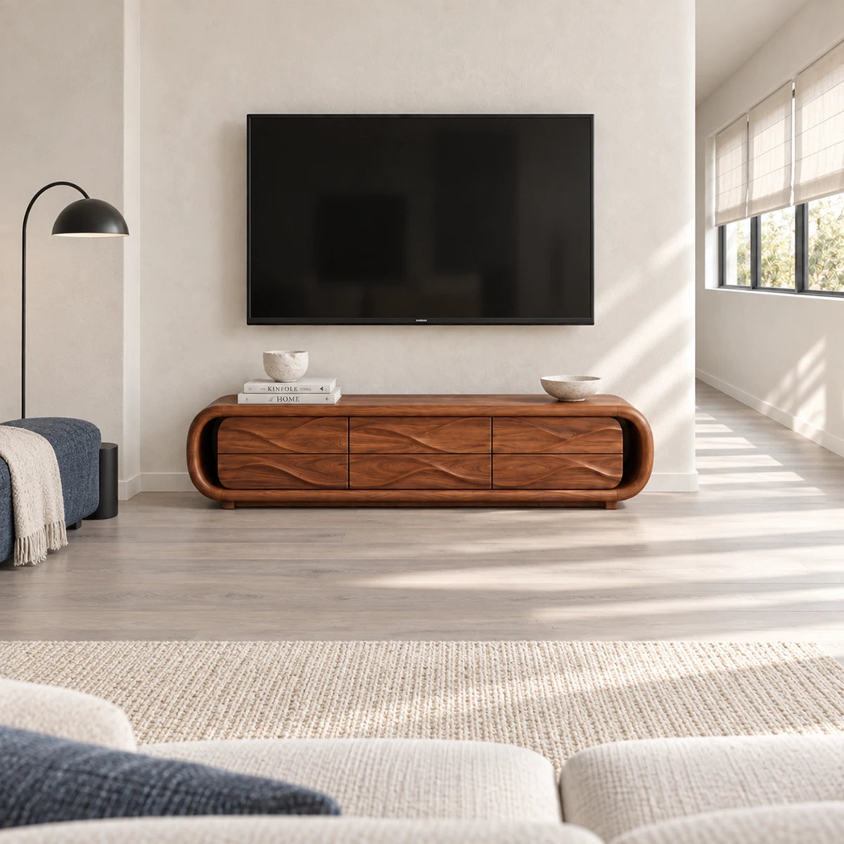 Elegant entertainment unit in solid wood with streamlined form and six-drawer storage
