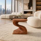 Accent end table featuring a flowing pedestal form and compact top for modern decor