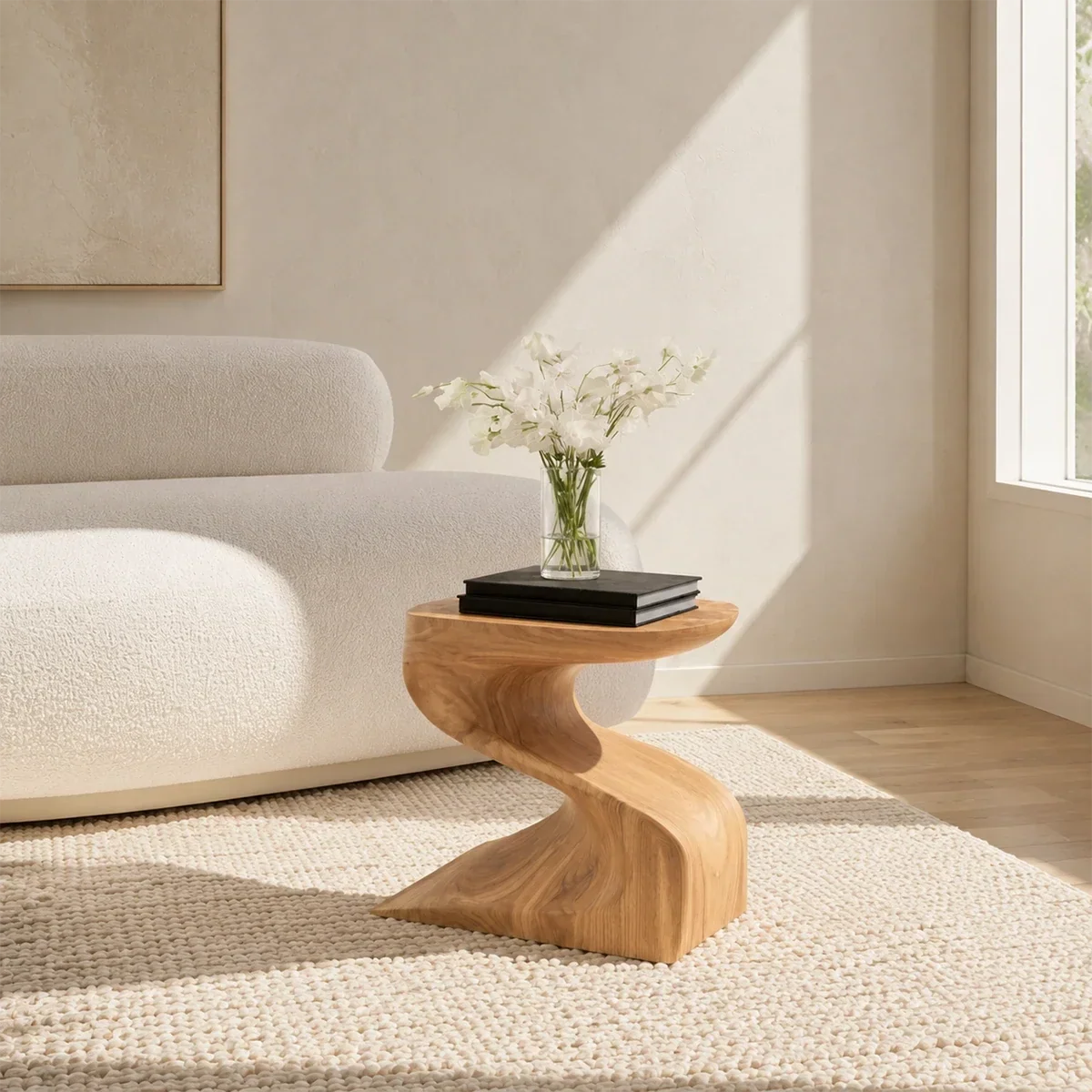 Luxury side table with sculptural pedestal base and compact top in a bright living room
