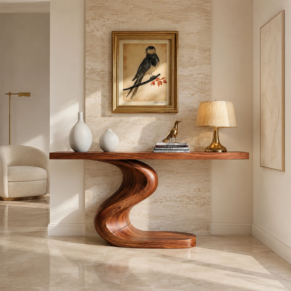 Sculptural console table with an S curve pedestal base in a bright modern hallway