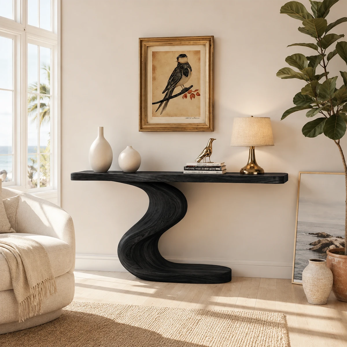 Curved console table displayed beneath framed art in a bright luxury home interior