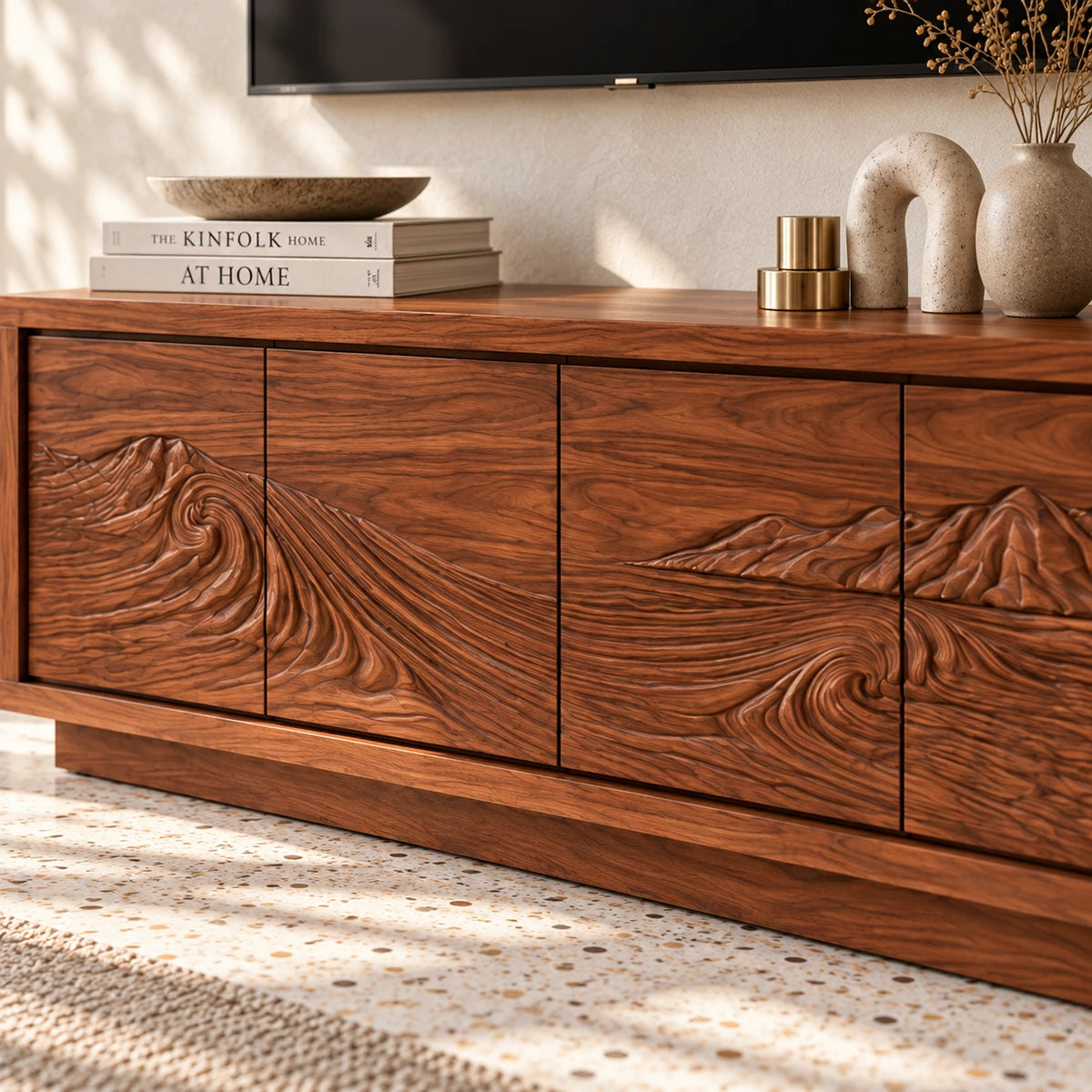 Low profile TV console in solid wood with hand-carved scenery and sleek storage design
