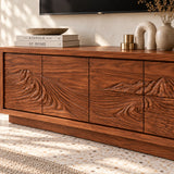 Low profile TV console in solid wood with hand-carved scenery and sleek storage design
