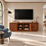 Statement media cabinet in solid wood with ocean wave carving and mountain motif
