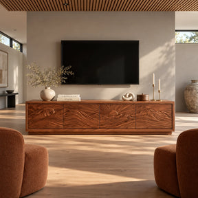 Modern media console in solid wood with scenic relief doors and wide storage base
