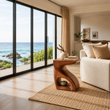 Organic modern side table with flowing curves and display nook in a bright living room