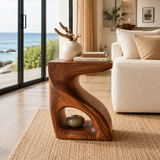 Accent end table featuring a sculpted frame and lower shelf for compact decor storage