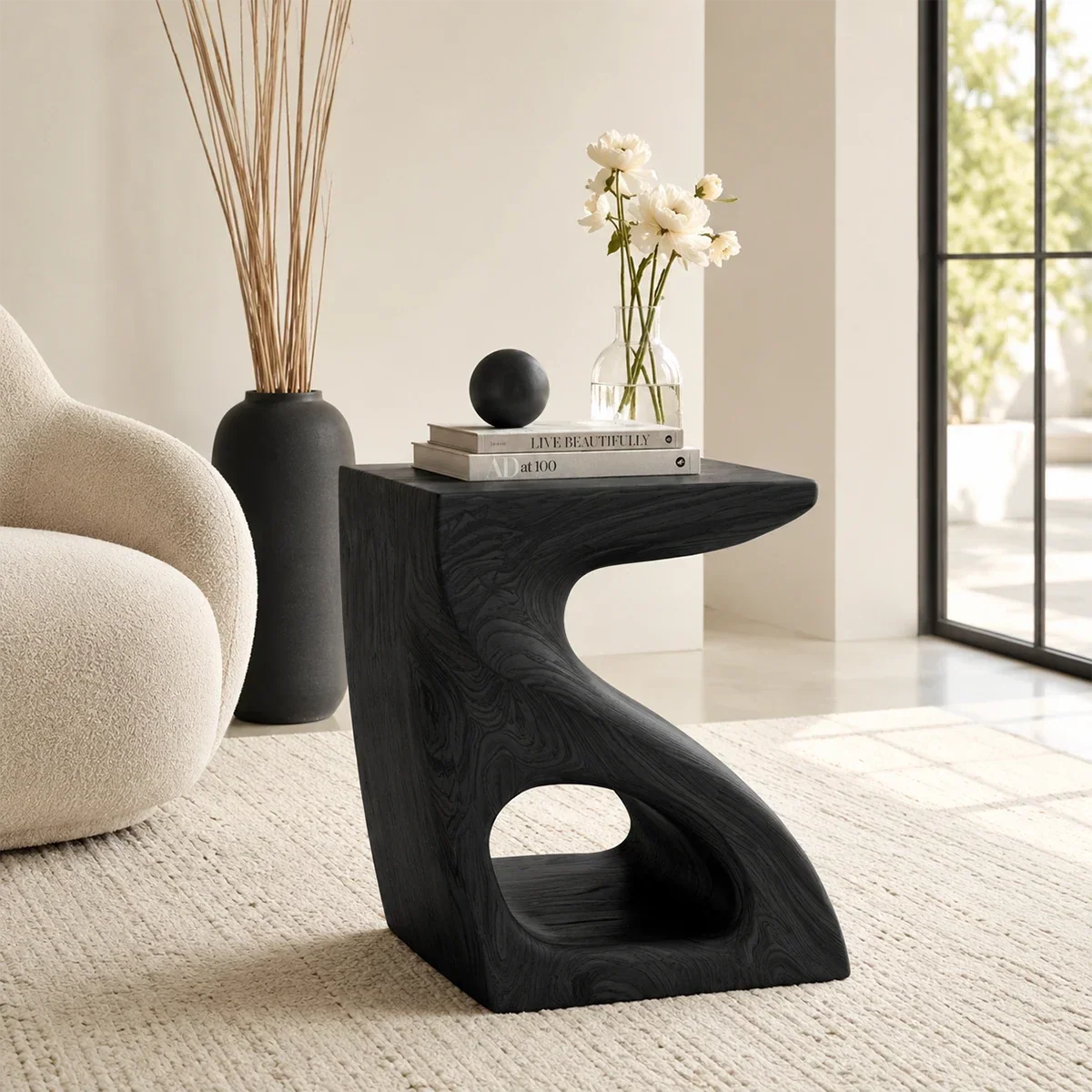 Contemporary end table showcases sculpted curves and warm wood tone in an airy home