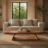 Organic shape coffee table with smooth edges and sculptural base for cozy modern spaces
