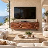 Low profile TV cabinet with flowing relief drawers adds function to a calm modern interior