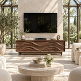 Living room TV stand with carved drawers blends artistic detail with useful media storage