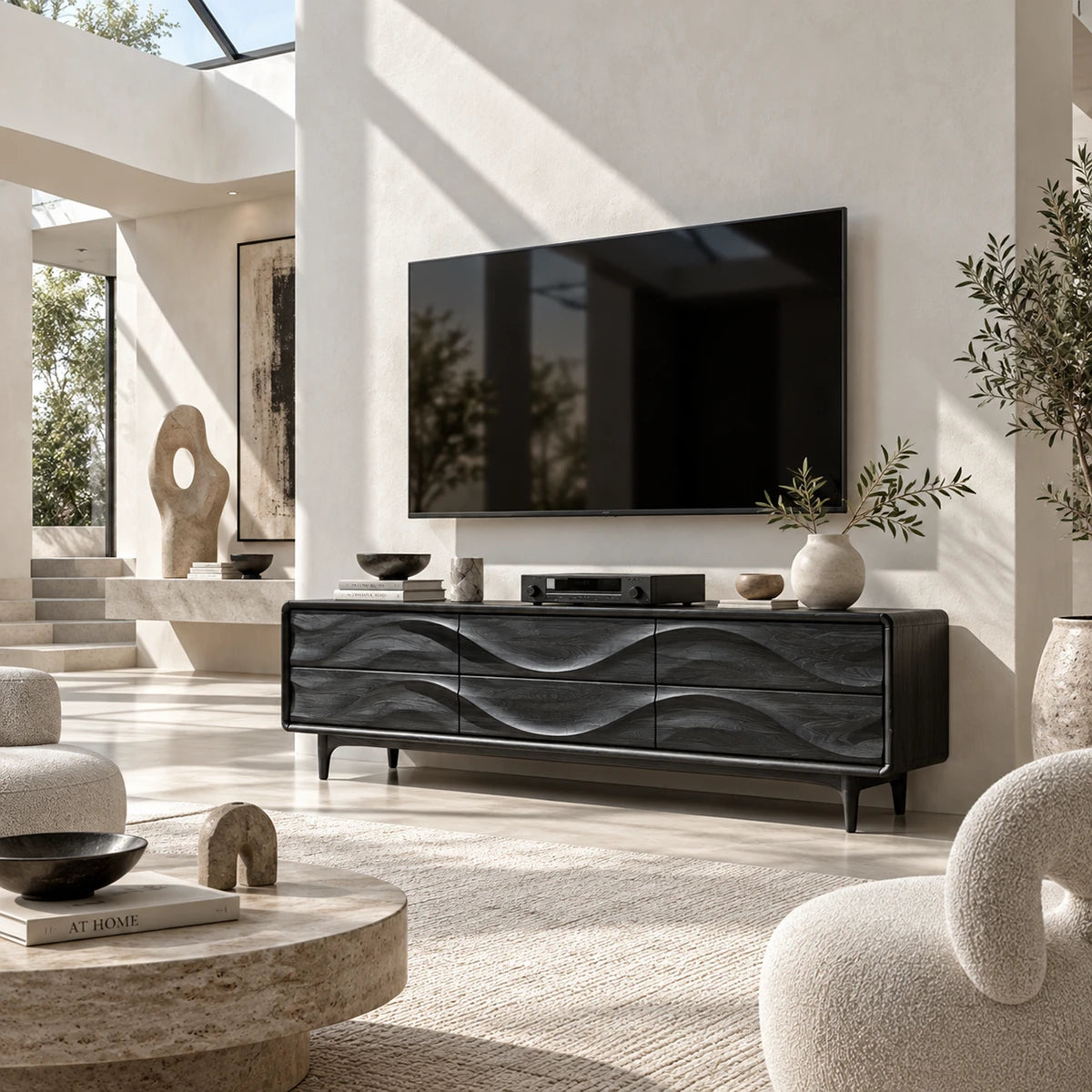 Solid wood TV cabinet with sculpted drawer panels adds depth beneath a mounted television