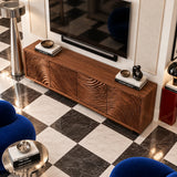This television stand in natural solid wood features four doors and carved waves