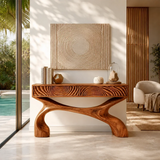 Minimalist console table with sculpted legs and dimensional drawers in airy interiors