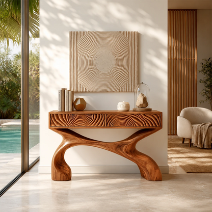 Sculptural console table with carved drawers and flowing base in a bright entryway