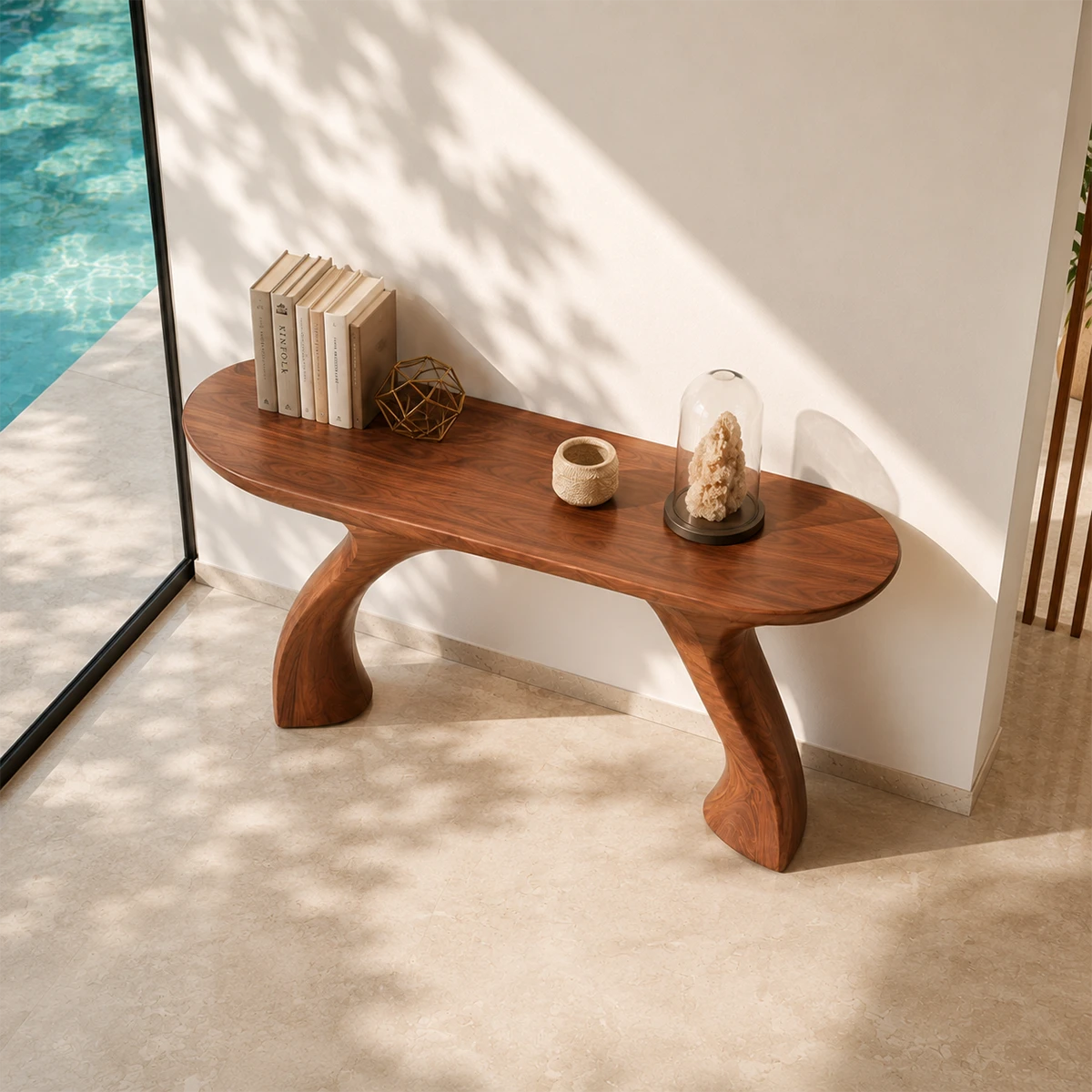 Narrow console table with a sculpted silhouette for refined foyer decor accents indoors