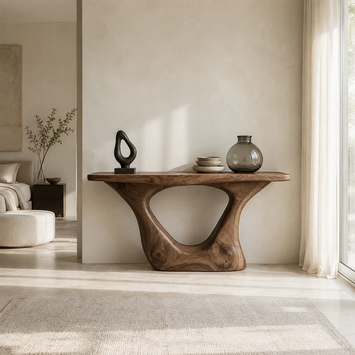 Sculptural console table with a bold cutout base in a calm modern entryway interior