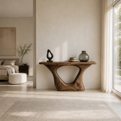 Organic modern console table featuring a rounded opening and warm wood tone finish