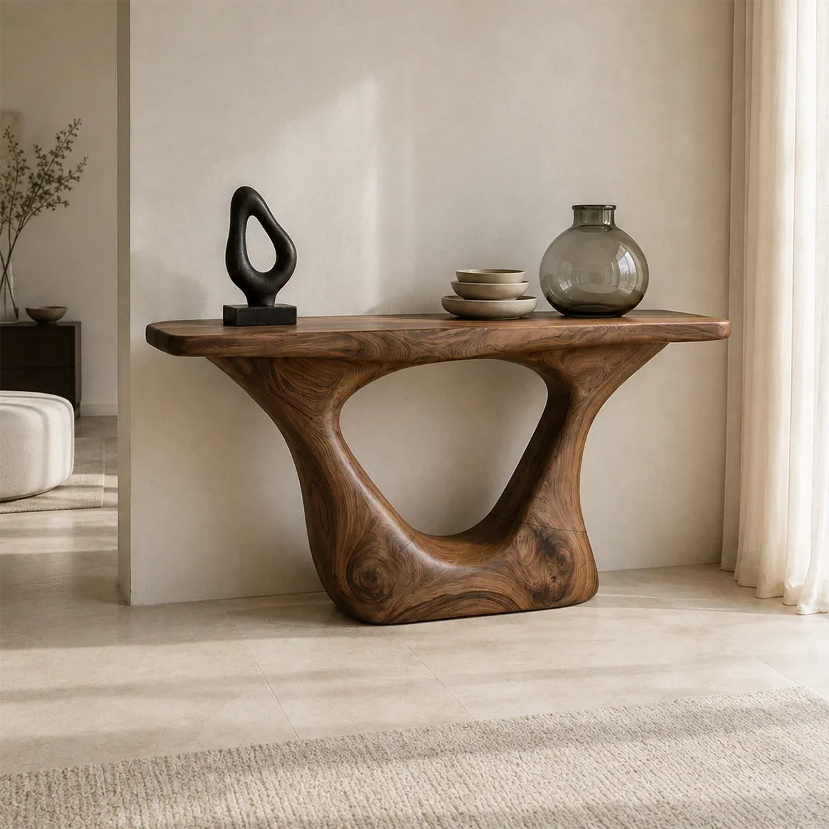Entryway console table with an open sculpted base and sleek top for decor display