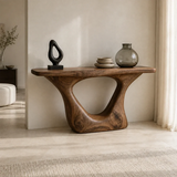 Entryway console table with an open sculpted base and sleek top for decor display