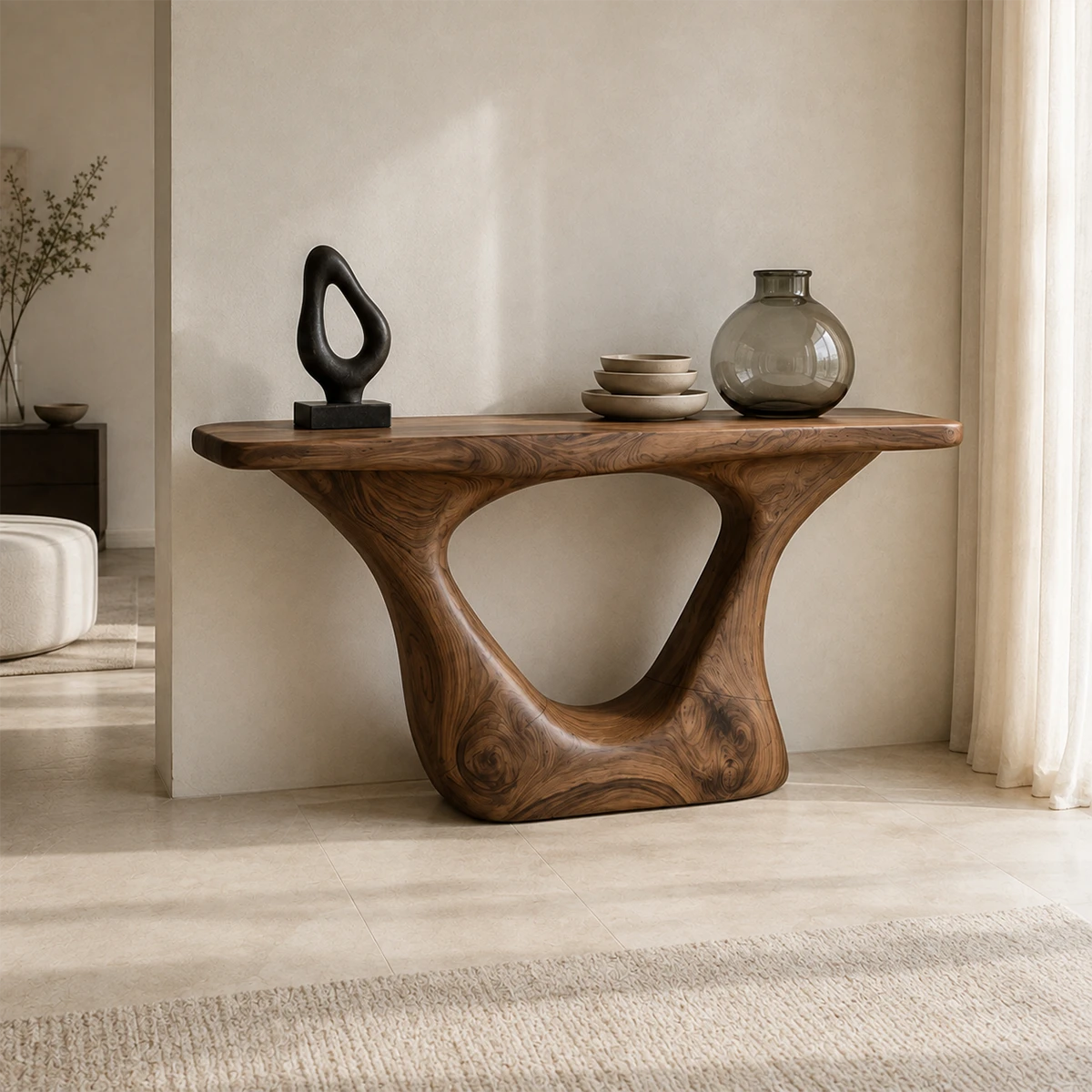 Entryway console table with an open sculpted base and sleek top for decor display