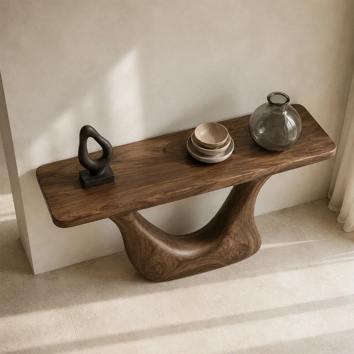 Narrow console table with a sculptural cutout frame for refined foyer decor styling