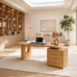 Spacious home office desk with drawer pedestal and sculptural support in a bright room